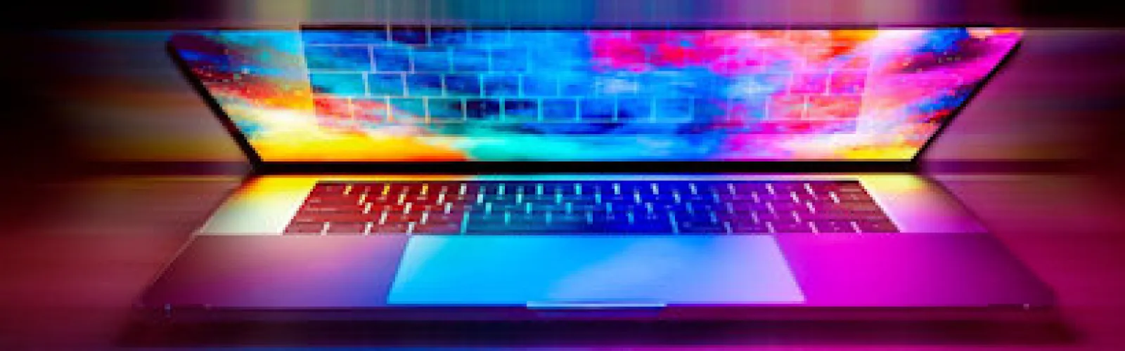 A laptop showing a colorful screen.